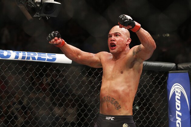 Robbie Lawler celebrates after defeating Rory MacDonald in their welterweight title mixed martial arts bout at UFC 189 on Saturday, July 11, 2015, in Las Vegas. (AP Photo/John Locher)