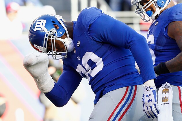 EAST RUTHERFORD, NJ - DECEMBER 20:   Jason Pierre-Paul #90 of the New York Giants reacts against the Carolina Panthers during their game at MetLife Stadium on December 20, 2015 in East Rutherford, New Jersey.  (Photo by Michael Reaves/Getty Images)