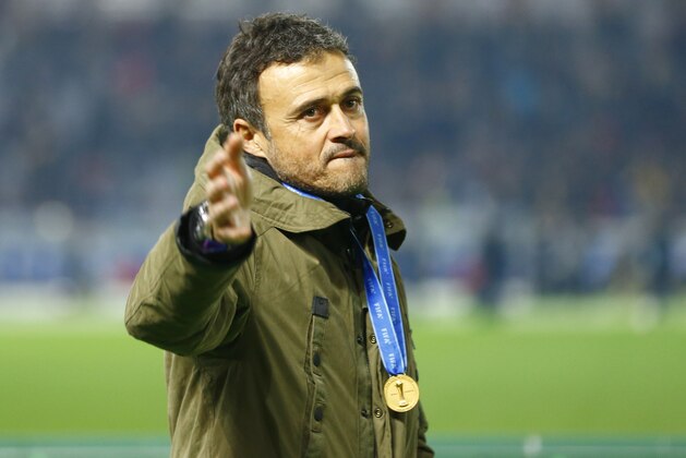 FC Barcelona’s coach Luis Enrique wearing the gold medal gestures after beating River Plate 3-0 in their final match at the FIFA Club World Cup soccer tournament in Yokohama, near Tokyo, Sunday, Dec. 20, 2015. (AP Photo/Shizuo Kambayashi)