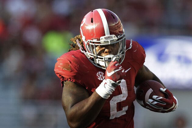 File - In this Saturday, Sept. 12, 2015, file photo Alabama running back Derrick Henry (2) runs the ball in for a touchdown during the second half of an NCAA college football game against Middle Tennessee, in Tuscaloosa, Ala. Henry bulldozed defenses while carrying Alabama's offense this season, and then walked away with a Heisman Trophy. The Crimson Tide's super-sized tailback won college football's most famous player of the year award Saturday, Dec. 12, 2015, becoming just the third running back to take the Heisman in the last 16 years. (AP Photo/Brynn Anderson,file)