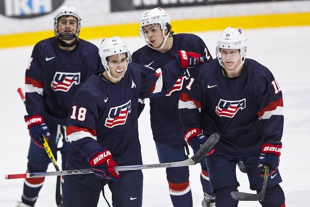 From left, Brandon Fortunato, Colin White, Charlie McAvoy and goal scorer Christian Dvorak,  celebrate the opening goal,  during the friendly hockey match between Finland and  USA in Lahti, Finland, Tuesday, Dec. 22, 2015, prior the 2016 IIHF World Junior U20 Hockey Championships tournament. (Roni Rekomaa/Lehtikuva via AP)  FINLAND OUT