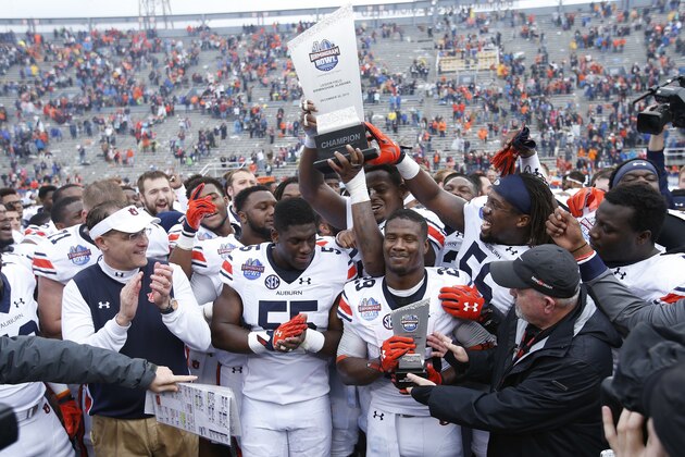 BIRMINGHAM, AL - DECEMBER 30: The Auburn Tigers celebrate after winning the Birmingham Bowl against the Memphis Tigers at Legion Field on December 30, 2015 in Birmingham, Alabama. Auburn defeated Memphis 31-10. (Photo by Joe Robbins/Getty Images) BIRMINGHAM, AL - DECEMBER 30: The Auburn Tigers celebrate after winning the Birmingham Bowl against the Memphis Tigers at Legion Field on December 30, 2015 in Birmingham, Alabama. Auburn defeated Memphis 31-10. (Photo by Joe Robbins/Getty Images)