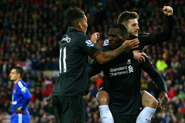 SUNDERLAND, ENGLAND - DECEMBER 30:  Christian Benteke of Liverpool celebrates with team-mate Adam Lallana and Roberto Firmino of Liverpool as Vito Mannone of Sunderland shows his dejection during the Barclays Premier League match between Sunderland and Liverpool at Stadium of Light on December 30, 2015 in Sunderland, England.  (Photo by Ian MacNicol/Getty Images)