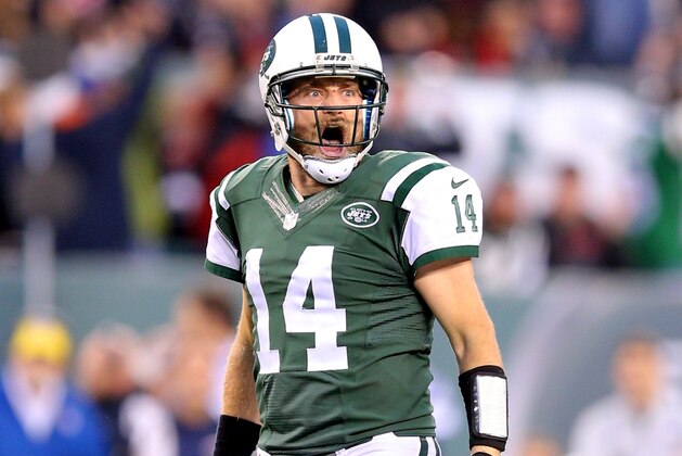 New York Jets quarterback Ryan Fitzpatrick (14) reacts after throwing a game winning touchdown in overtime against the New England Patriots during an NFL game at MetLife Stadium in East Rutherford, N.J. on Sunday, Dec. 27, 2015. (AP Photo/Brad Penner)