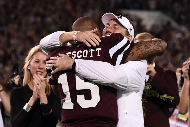 STARKVILLE, MS - NOVEMBER 28:  Head coach Dan Mullen of the Mississippi State Bulldogs greets Dak Prescott #15 at midfield prior to a game against the Mississippi Rebels at Davis Wade Stadium on November 28, 2015 in Starkville, Mississippi.  Mississippi defeated Mississippi State 38-27.  (Photo by Stacy Revere/Getty Images)