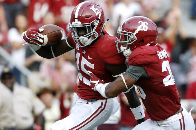 Alabama defensive back Ronnie Harrison (15) celebrates his interception with defensive back Marlon Humphrey (26) during the second half of an NCAA college football game against Louisiana Monroe in Tuscaloosa, Ala., Saturday, Sept. 26, 2015. (AP Photo/Jonathan Bachman)