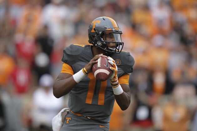 Tennessee quarterback Joshua Dobbs (11) looks for a receiver an NCAA college football game against Georgia Saturday, Oct. 10, 2015 in Knoxville, Tenn. (AP Photo/Wade Payne)