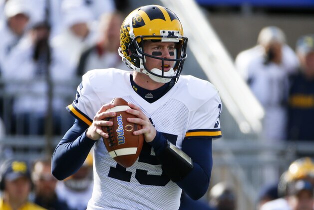 Michigan quarterback Jake Rudock (15) plays during an NCAA college football game against Penn State in State College, Pa., Saturday, Nov. 21, 2015. (AP Photo/Gene J. Puskar)