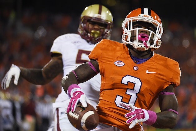 Clemson wide receiver Artavis Scott (3) runs into the end zone for a touchdown as Boston College defensive back Kamrin Moore (5) defends during the second half of an NCAA college football game, Saturday, Oct. 17, 2015, in Clemson, S.C. (AP Photo/Rainier Ehrhardt)