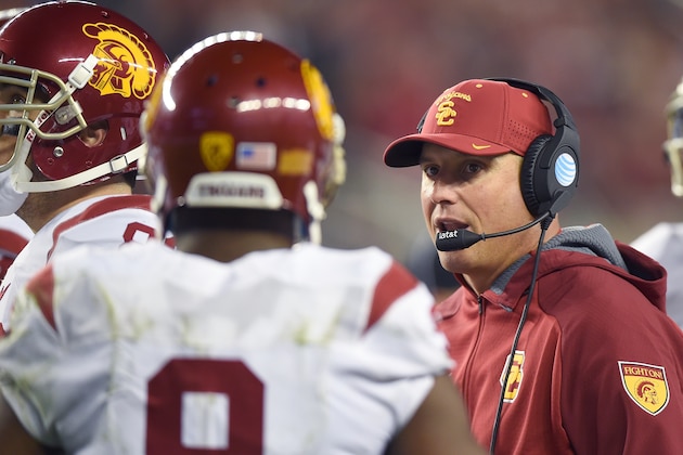 SANTA CLARA, CA - DECEMBER 05:  Head coach Clay Helton of the USC Trojans talks with his players while there's a time-out against the Stanford Cardinal during the second quarter of the NCAA Pac-12 Championship game at Levi's Stadium on December 5, 2015 in Santa Clara, California.  (Photo by Thearon W. Henderson/Getty Images)