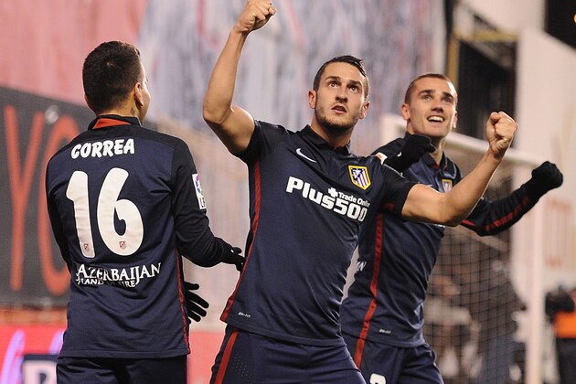 MADRID, SPAIN - DECEMBER 30:  Antoine Greizmann of Club Atletico de Madrid celebrates with Koke and  Angel Correa  after scoring Atletico's 2nd goal during the La Liga match between Rayo Vallecano and Club Atletico de Madrid at Estadio de Vallecas on December 30, 2015 in Madrid, Spain.  (Photo by Denis Doyle/Getty Images)