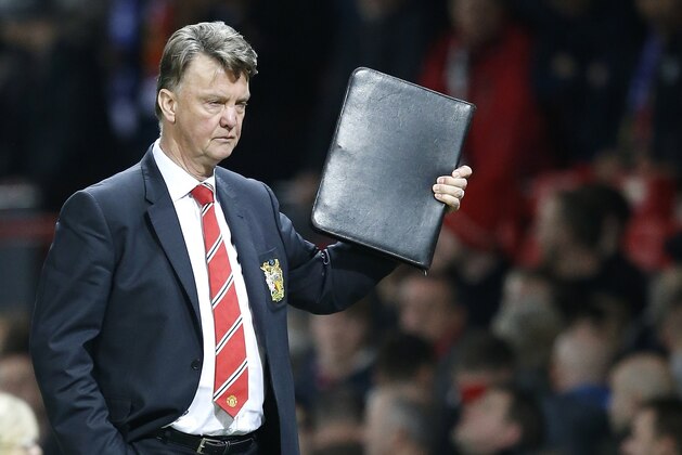 Manchester United's manager Louis van Gaal leaves at the end of the English Premier League soccer match between Manchester United and Chelsea at Old Trafford Stadium, Manchester, England, Monday, Dec. 28, 2015. (AP Photo/Jon Super)