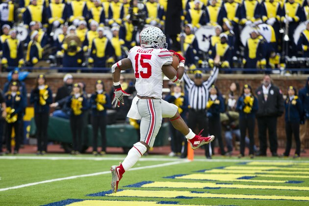 Ohio State running back Ezekiel Elliott (15) high steps into the end zone to score a touchdown in the second quarter of an NCAA college football game against Michigan in Ann Arbor, Mich., Saturday, Nov. 28, 2015. (AP Photo/Tony Ding)