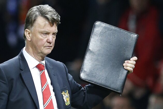 Manchester United's manager Louis van Gaal leaves at the end of the English Premier League soccer match between Manchester United and Chelsea at Old Trafford Stadium, Manchester, England, Monday, Dec. 28, 2015. (AP Photo/Jon Super)