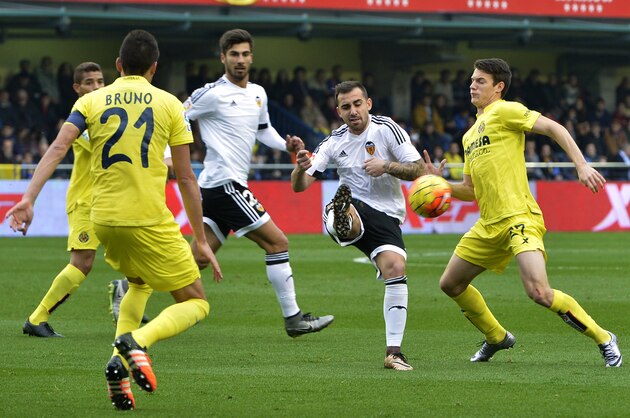 Valencia's forward Paco Alcacer (2ndR) vies with Villarreal's midfielder Adrian Marin (R) during the Spanish league football match Villarreal CF vs Valencia CF at El Madrigal stadium in Villareal on December 31, 2015.   AFP PHOTO/ JOSE JORDAN / AFP / JOSE JORDAN        (Photo credit should read JOSE JORDAN/AFP/Getty Images)