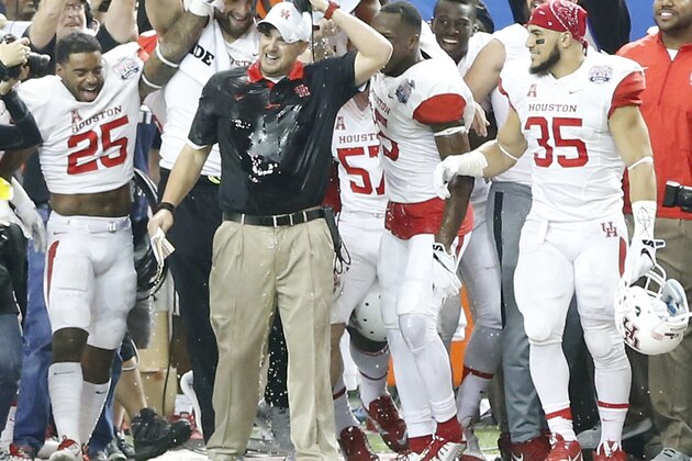 Houston head coach Tom Herman is doused with sports drink during the second half of the Peach Bowl NCAA college football game against Florida State, Thursday, Dec. 31, 2015, in Atlanta. Houston won 38-24. (AP Photo/John Bazemore)