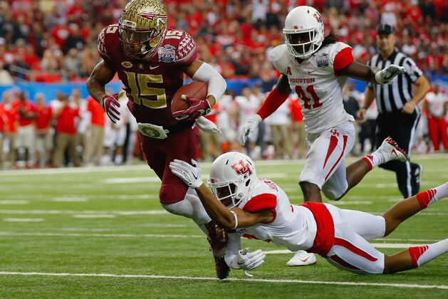 ATLANTA, GA - DECEMBER 31: Lee Hightower #18 of the Houston Cougars tackles Travis Rudolph #15 of the Florida State Seminoles in the third quarter during the Chick-fil-A Peach Bowl at the Georgia Dome on December 31, 2015 in Atlanta, Georgia. (Photo by Kevin C. Cox/Getty Images) ATLANTA, GA - DECEMBER 31: Lee Hightower #18 of the Houston Cougars tackles Travis Rudolph #15 of the Florida State Seminoles in the third quarter during the Chick-fil-A Peach Bowl at the Georgia Dome on December 31, 2015 in Atlanta, Georgia. (Photo by Kevin C. Cox/Getty Images)