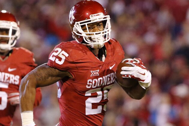 Oklahoma running back Joe Mixon (25) runs the ball in for a touchdown against Iowa State during the fourth quarter of an NCAA college football game in Norman, Okla., on Saturday, Nov. 7, 2015. Oklahoma won 52-16. (AP Photo/Alonzo Adams)