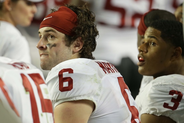 Oklahoma quarterback Baker Mayfield (6) and wide receiver Sterling Shepard (3) look up at the scoreboard during the second half of the Orange Bowl NCAA college football semifinal playoff game against Clemson, Thursday, Dec. 31, 2015, in Miami Gardens, Fla.  (AP Photo/Lynne Sladky)