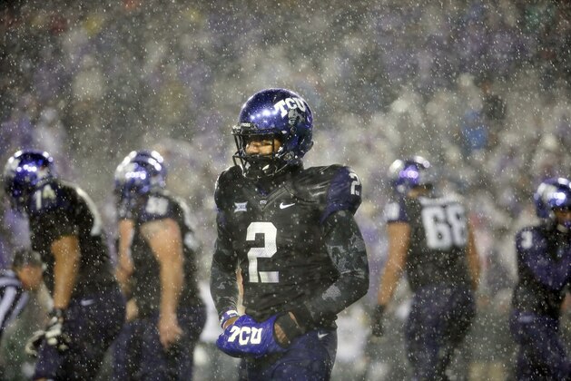 TCU quarterback Trevone Boykin waits for the play to be signaled to him in a pouring rain in the second half of an NCAA college football game against Baylor, Friday, Nov. 27, 2015, in Fort Worth, Texas. (AP Photo/Tony Gutierrez)