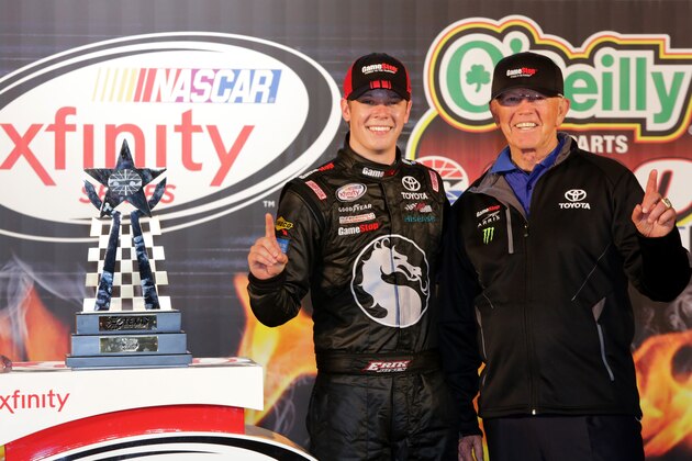 FORT WORTH, TX - APRIL 10:  Erik Jones, driver of the #20 GameStop/Mortal Kombat X Toyota, and team owner Joe Gibbs pose with the trophy in Victory Lane after winning the NASCAR XFINITY Series O'Reilly Auto Parts 300 at Texas Motor Speedway on April 10, 2015 in Fort Worth, Texas.  (Photo by Jerry Markland/Getty Images for Texas Motor Speedway)