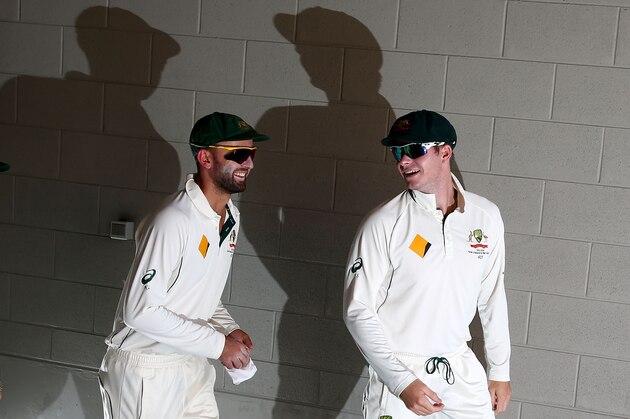 MELBOURNE, AUSTRALIA - DECEMBER 29:  Nathan Lyon and Steven Smith of Australia walk out to field during day four of the Second Test match between Australia and the West Indies at the Melbourne Cricket Ground on December 29, 2015 in Melbourne, Australia.  (Photo by Scott Barbour/Getty Images)