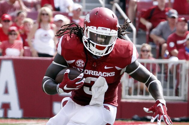 Arkansas' Alex Collins runs down the field during the first half of the NCAA college football game against UTEP in Fayetteville, Ark., Saturday, Sept. 5, 2015.   (AP Photo/Samantha Baker)