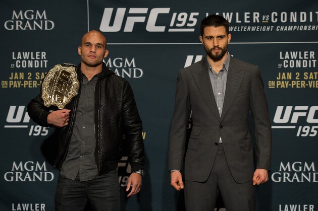 LAS VEGAS, NEVADA - DECEMBER 31:  (L-R) UFC welterweight champion Robbie Lawler and Carlos Condit pose for a picture after facing off during the Ultimate Media Day at the MGM Grand Hotel/Casino on December 31, 2015 in Las Vegas Nevada. (Photo by Brandon Magnus/Zuffa LLC/Zuffa LLC via Getty Images)