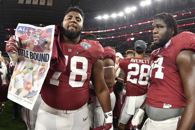 Dec 31, 2015; Arlington, TX, USA; Alabama Crimson Tide offensive lineman Korren Kirven (78) holds up a paper after the game against the Michigan State Spartans in the 2015 CFP semifinal at the Cotton Bowl at AT&T Stadium. Alabama won 38-0. Mandatory Credit: Jerome Miron-USA TODAY Sports