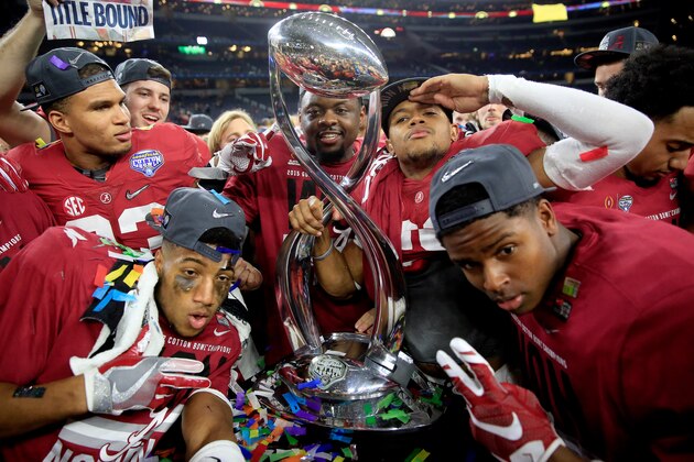 ARLINGTON, TX - DECEMBER 31:  The Alabama Crimson Tide celebrate with the trophy after defeating the Michigan State Spartans 38 to 0 in the Goodyear Cotton Bowl at AT&T Stadium on December 31, 2015 in Arlington, Texas.  (Photo by Jamie Squire/Getty Images)