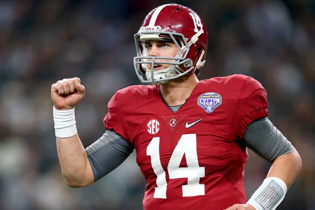 ARLINGTON, TX - DECEMBER 31:  Quarterback Jake Coker #14 of the Alabama Crimson Tide celebrates after teammate running back Derrick Henry #2 scores in the second quarter against the Michigan State Spartans during the Goodyear Cotton Bowl at AT&T Stadium on December 31, 2015 in Arlington, Texas.  (Photo by Ronald Martinez/Getty Images)