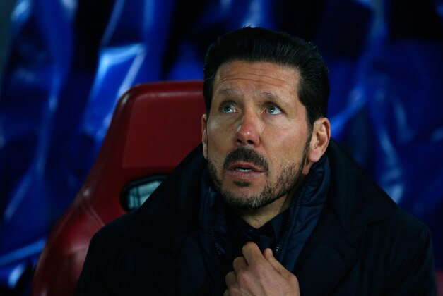 Atletico's coach Diego Simeone sits on the bench before  the Champions League Group C soccer match between Atletico Madrid and Galatasaray at the Vicente Calderon stadium in Madrid, Spain, Wednesday Nov. 25, 2015. (AP Photo/Francisco Seco)