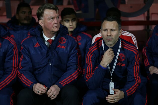 Manchester United manager Louis van Gaal, left, and assistant manager Ryan Giggs, look across the pitch before the English Premier League soccer match between Bournemouth and Manchester United at the Vitality Stadium in Bournemouth, England, Saturday Dec. 12, 2015. (AP Photo/Tim Ireland)