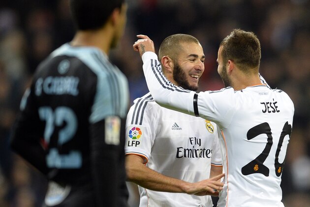 Real Madrid's French forward Karim Benzema (C) celebrates with Real Madrid's midfielder Jese (R) after scoring during the Spanish league football match Real Madrid vs RC Celta de Vigo at the Santiago Bernabeu stadium in Madrid on January 6, 2014.    AFP PHOTO / GERARD JULIEN        (Photo credit should read GERARD JULIEN/AFP/Getty Images)