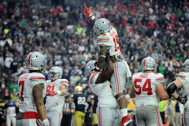 Jan 1, 2016; Glendale, AZ, USA; Ohio State Buckeyes running back Ezekiel Elliott (15) celebrates a touchdown against the Notre Dame Fighting Irish during the first half of the 2016 Fiesta Bowl at University of Phoenix Stadium. Mandatory Credit: Joe Camporeale-USA TODAY Sports