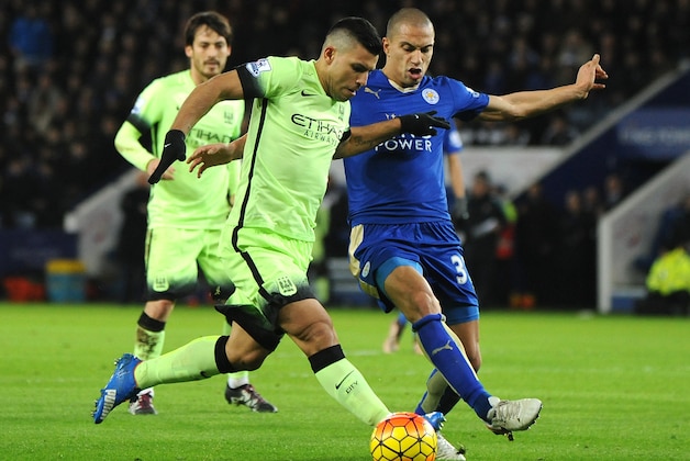 Manchester City’s Sergio Aguero, left. is tackled by Leicester’s Gokhan Inler during the English Premier League soccer match between Leicester City and Manchester City at the King Power Stadium in Leicester, England, Tuesday, Dec. 29, 2015. (AP Photo/Rui Vieira)