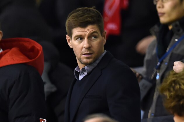 Liverpool's former captain Steven Gerrard waits for kickoff in the crowd ahead of the English Premier League football match between Liverpool and Swansea City at the Anfield stadium in Liverpool, north-west England on November 29, 2015.   AFP PHOTO / PAUL ELLIS

RESTRICTED TO EDITORIAL USE. No use with unauthorized audio, video, data, fixture lists, club/league logos or 'live' services. Online in-match use limited to 75 images, no video emulation. No use in betting, games or single club/league/player publications. / AFP / PAUL ELLIS        (Photo credit should read PAUL ELLIS/AFP/Getty Images)