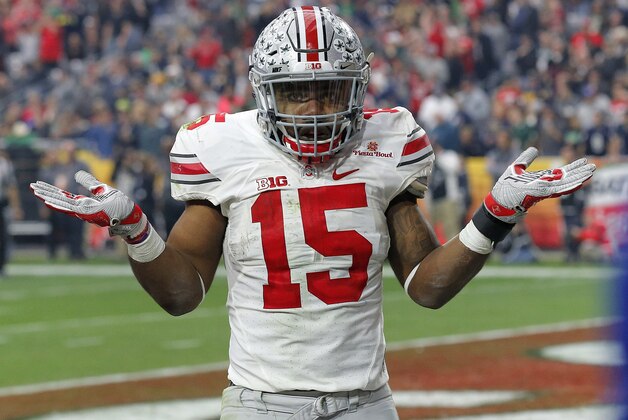 Ohio State running back Ezekiel Elliott (15) gestures as he celebrates his fourth touchdown of the game against Notre Dame  during the second half of the Fiesta Bowl NCAA College football game, Friday, Jan. 1, 2016, in Glendale, Ariz.  (AP Photo/Ross D. Franklin)