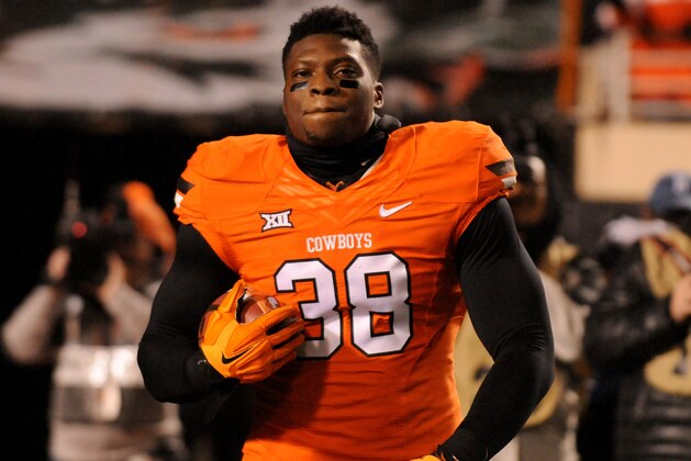 Oklahoma State defensive end Emmanuel Ogbah takes the field prior to  an NCAA college football game between Oklahoma and Oklahoma St in Stillwater, Okla., Saturday, Nov. 28, 2015.(AP Photo/Brody Schmidt)