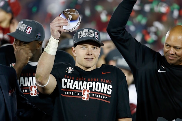 PASADENA, CA - JANUARY 01:  Christian McCaffrey #5 of the Stanford Cardinal holds up the offensive player of the game award as head coach David Shaw of the Stanford Cardinal looks on following Stanford's 45-16 win over the Iowa Hawkeyes in the 102nd Rose Bowl Game on January 1, 2016 at the Rose Bowl in Pasadena, California.  (Photo by Sean M. Haffey/Getty Images)
