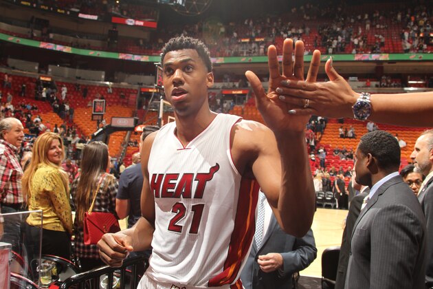 MIAMI, FL - JANUARY 1:  Hassan Whiteside #21 of the Miami Heat shakes hands with some fans after the game against the Dallas Mavericks on January 1, 2016 at American Airlines Arena in Miami, Florida. NOTE TO USER: User expressly acknowledges and agrees that, by downloading and or using this Photograph, user is consenting to the terms and conditions of the Getty Images License Agreement. Mandatory Copyright Notice: Copyright 2016 NBAE (Photo by Issac Baldizon/NBAE via Getty Images)