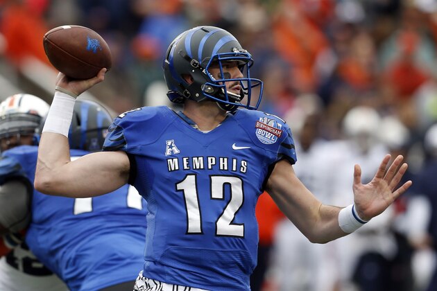 Memphis quarterback Paxton Lynch (12) throws a pass during the first half of the Birmingham Bowl NCAA college football game against Auburn Auburn, Wednesday, Dec. 30, 2015, in Birmingham, Ala. (AP Photo/Butch Dill)