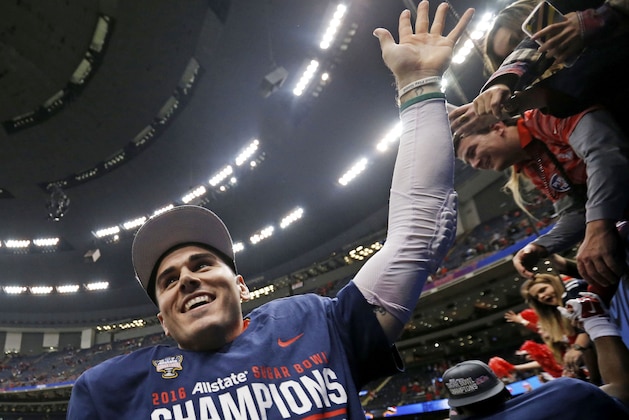 Mississippi quarterback Chad Kelly (10) reacts with fans after their victory over Oklahoma State in the Sugar Bowl college football game in New Orleans, Friday, Jan. 1, 2016. Mississippi won 48-20. (AP Photo/Jonathan Bachman)