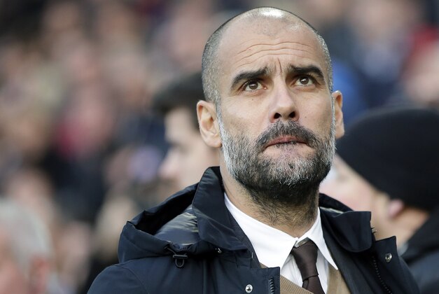 Bayern head coach Pep Guardiola arrives for the German Bundesliga soccer match between Hannover 96 and FC Bayern Munich in Hannover, Germany, Saturday, Dec. 19, 2015. (AP Photo/Michael Sohn) Bayern head coach Pep Guardiola arrives for the German Bundesliga soccer match between Hannover 96 and FC Bayern Munich in Hannover, Germany, Saturday, Dec. 19, 2015. (AP Photo/Michael Sohn)