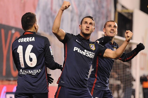 MADRID, SPAIN - DECEMBER 30:  Antoine Greizmann of Club Atletico de Madrid celebrates with Koke and  Angel Correa  after scoring Atletico's 2nd goal during the La Liga match between Rayo Vallecano and Club Atletico de Madrid at Estadio de Vallecas on December 30, 2015 in Madrid, Spain.  (Photo by Denis Doyle/Getty Images)