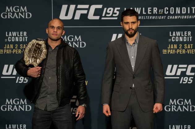 LAS VEGAS, NEVADA - DECEMBER 31:  (L-R) UFC welterweight champion Robbie Lawler and Carlos Condit pose for a picture after facing off during the Ultimate Media Day at the MGM Grand Hotel/Casino on December 31, 2015 in Las Vegas Nevada. (Photo by Brandon Magnus/Zuffa LLC/Zuffa LLC via Getty Images)