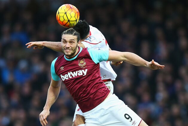 LONDON, ENGLAND - JANUARY 02: Andy Carroll of West Ham United and Emre Can of Liverpool compete for the ball during the Barclays Premier League match between West Ham United and Liverpool at Boleyn Ground on January 2, 2016 in London, England.  (Photo by Clive Rose/Getty Images)