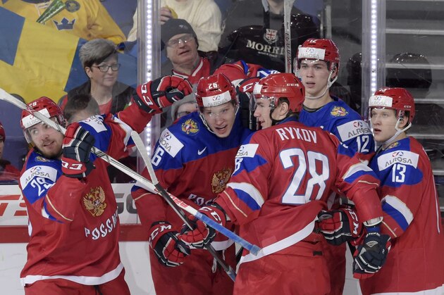 Russia's Yegor Korshkov, center, celebrates scoring with teammates Nikita Zhuldikov, Yegor Rykov, Pavel Kraskovski and Alexander Polunin during the 2016 IIHF World Junior Ice Hockey Championship quarterfinal match between Russia and Denmark in Helsinki, Finland, Saturday Jan. 2, 2016. (Markku Ulander/Lehtikuva via AP) FINLAND OUT