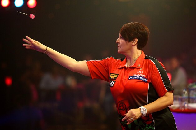 FRIMLEY, ENGLAND - JANUARY 09: Lisa Ashton of England in action during her semi final match against Sharon Prins of Holland during the BDO Lakeside World Professional Darts Championships on Day Seven at The Lakeside Country Club on January 09, 2014 in Frimley, England. (Photo by Charlie Crowhurst/Getty Images)