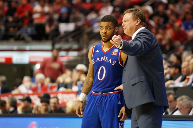 SAN DIEGO, CA - DECEMBER 22: Head coach Bill Self of the Kansas Jayhawks talks to Frank Mason III